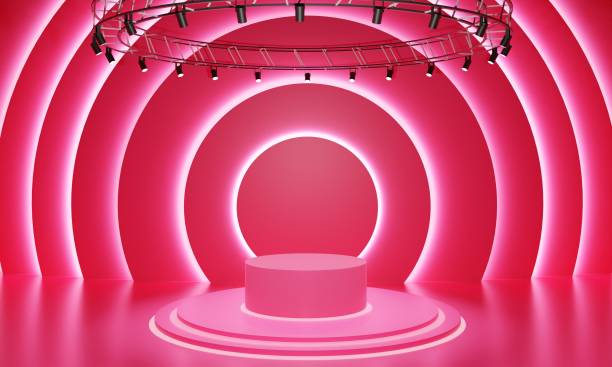 istock pink podium with spotlight on the stage.3d rendering. 1368503402