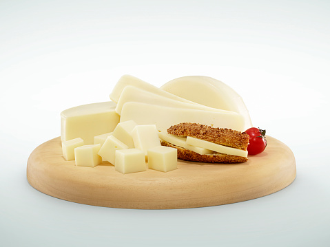 Cheese plate full of delicatessen on white background