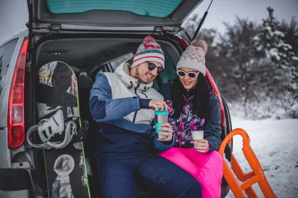 istock Couple drinking hot drink in nature in winter 1368511714