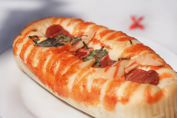 istock Sausage bread Out of focus, noised blurry background 1368514548