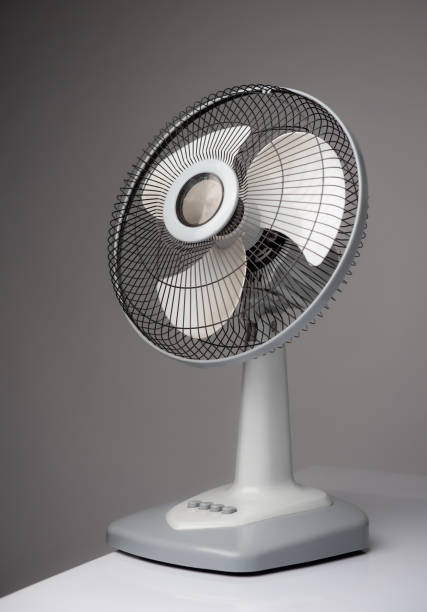 istock Gray electric fan on white table; Space for text 1368515713