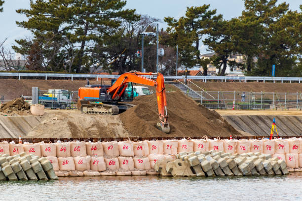 istock Hydraulic excavator digging soil on the riverbank 1368516522
