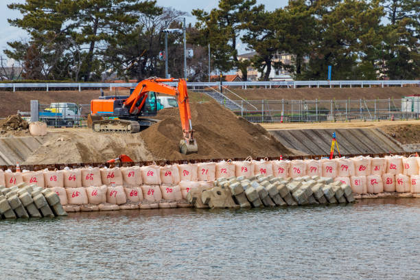 istock Hydraulic excavator digging soil on the riverbank 1368516530