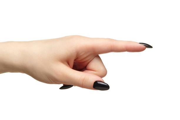 istock Female hand with black nails manicure isolated on white background. 1368516662