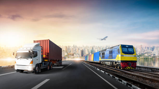 Global business logistics import export of Container Truck on highway and Freight Train with Cargo Plane at city background, Sunset time, Transportation industry concept, Depth blur effect stock photo