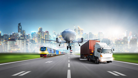 Global business logistics import export of Cargo Plane and Container Truck on highway with Freight Train at city background, Transportation industry concept, Depth blur effect