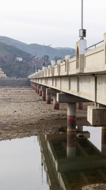 istock Concrete bridge over a dry river in winter 1368524557