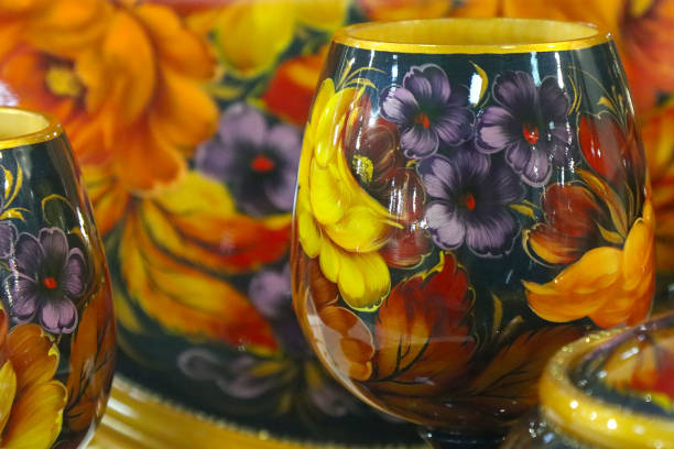 Decorative antique Zhostovo painting on household utensils.