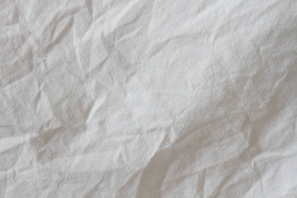 istock Wrinkled sheet. White fabric close-up. Burlap texture. Sheet on the bed. 1368527732