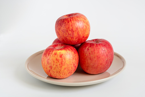 Fresh red apples on white background