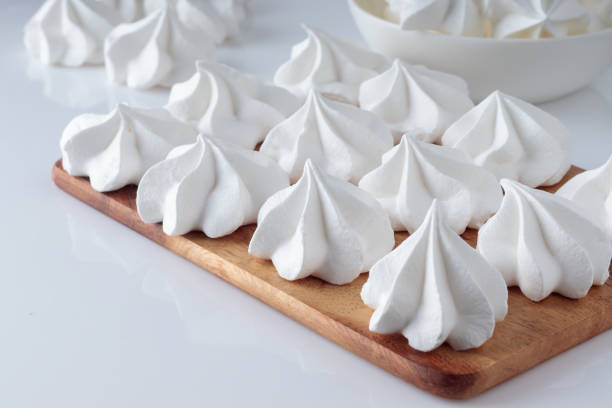 istock White sweet meringue on wooden cooking board 1368530074