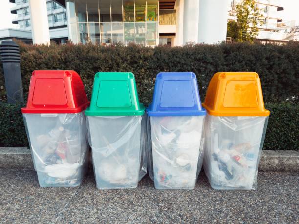 istock Recycle bin red green blue yellow with garbage inside 1368530823