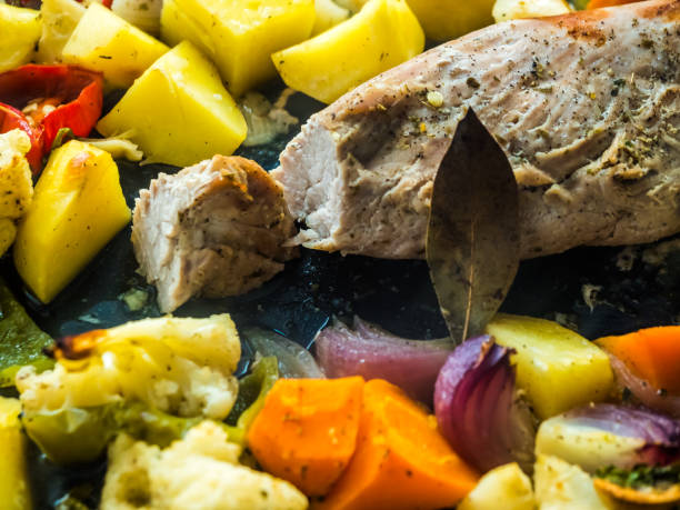 preparing pork leg with vegetables and red wine in the pan. - bay leaf healthy eating food and drink red imagens e fotografias de stock