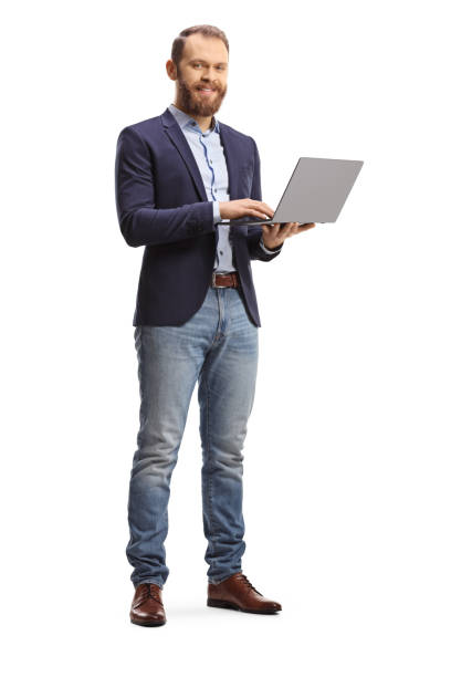istock Man in a suit and jeans holding an open laptop computer 1368532747