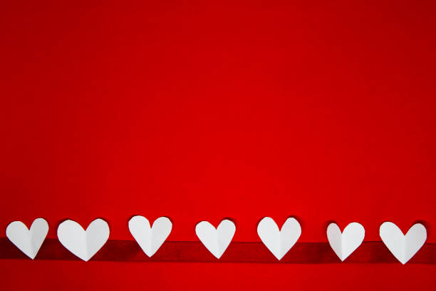 istock valentine background with copy space concept, white hearts on red backgrounds with text for space 1368535188