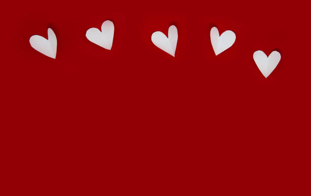 istock valentine background with copy space concept, white hearts on red backgrounds. 1368535201