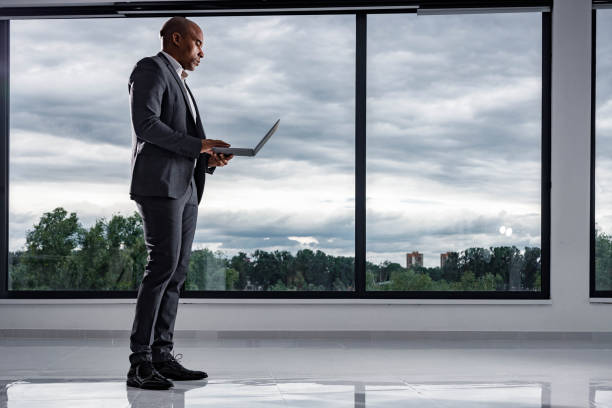 istock African American businessman using laptop in the office. 1368536397