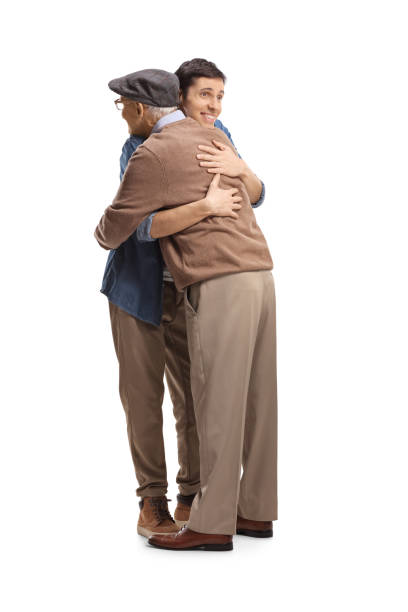 istock Happy young man hugging an elderly man 1368536498