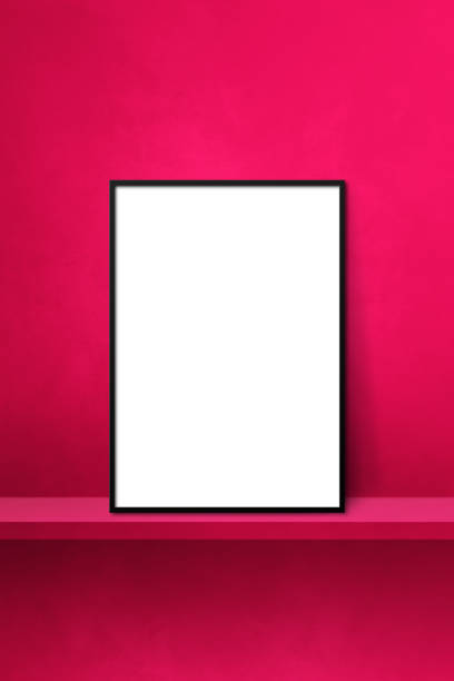 istock Black picture frame leaning on a pink shelf. 3d illustration. Vertical background 1368537013