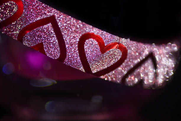 Red heart in silver chains. Background for valentine day. Photo