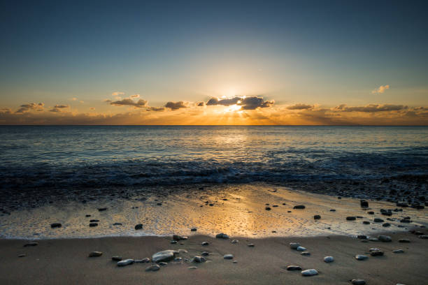 istock Perfect seascape view from a beach at sunset 1368537889