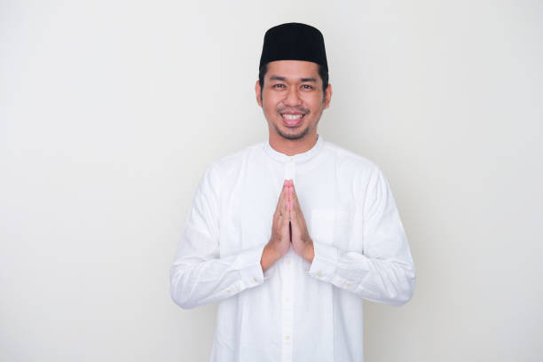 istock Moslem Asian man smiling to give greeting during Ramadan celebration 1368543276