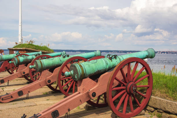 istock Old historic canons on Kronborg castle pointing to the ocean 1368543641