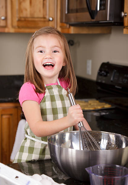 istock Little Girl Baking in the Kitchen 136854463