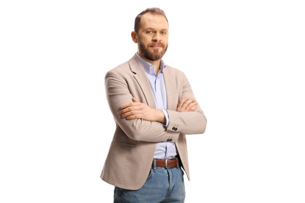 istock Young professional man in a beige suit and jeans posing 1368544831