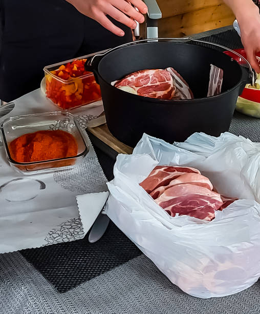 istock Preparation for layered meat in the Dutch oven 1368545823