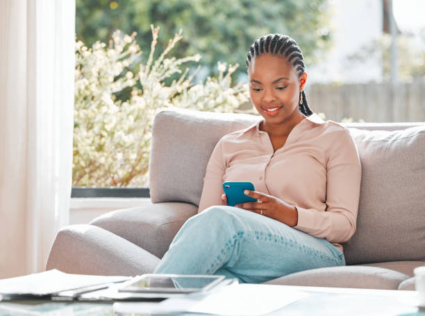 istock Shot of a young woman using her smartphone to send a text message 1368545885