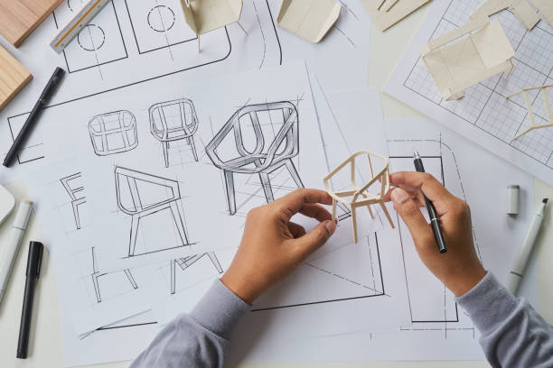 istock Designer sketching drawing design development product plan draft chair armchair Wingback Interior furniture prototype manufacturing production. designer studio concept . 1368546201