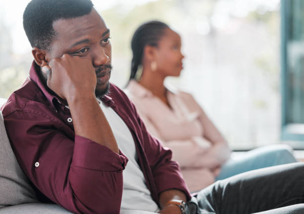 Shot of a young couple ignoring each other during an argument I'd rather be anywhere but here black couple divorce stock pictures, royalty-free photos & images