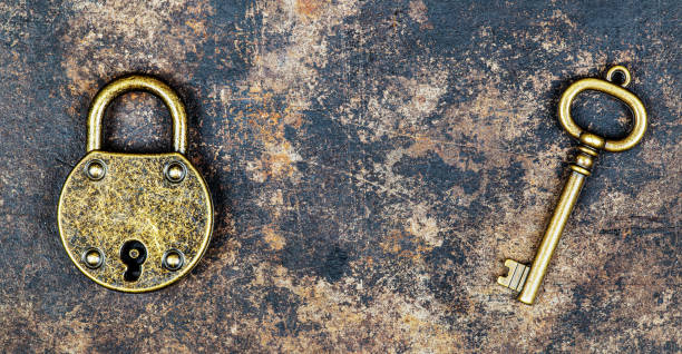 istock Vintage key and padlock, escape room game concept 1368547360