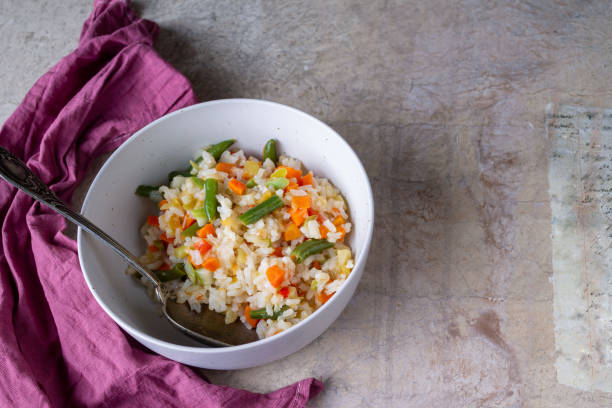 istock stewed rice with vegetables, red napkin, copy space 1368547611