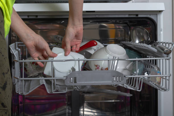 istock Get clean washed dishes from the dishwasher 1368549574