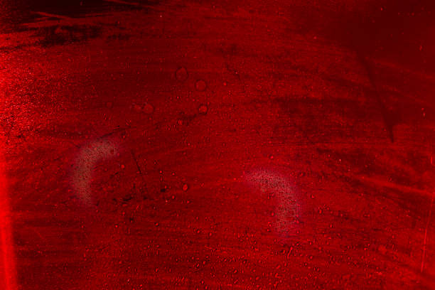 istock Glass with water drops on red background. 1368549930