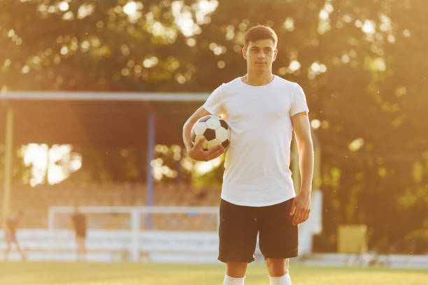 istock Standing and posing. Young soccer player have training on the sportive field 1368550892