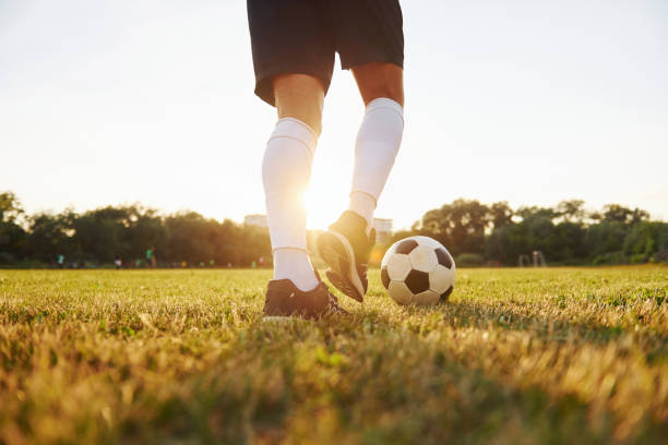 istock Close up view. Young soccer player have training on the sportive field 1368551275