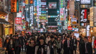istock Time lapse of crowd pedestrian walking on the shopping street in Shinjuku, Tokyo 1368551387