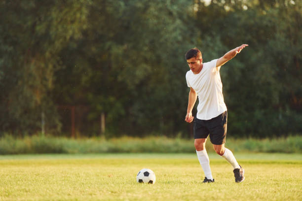 istock Professional practice. Young soccer player have training on the sportive field 1368551458