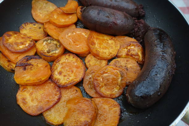 istock Black pork sausage and minced sweet potato being fried 1368551496