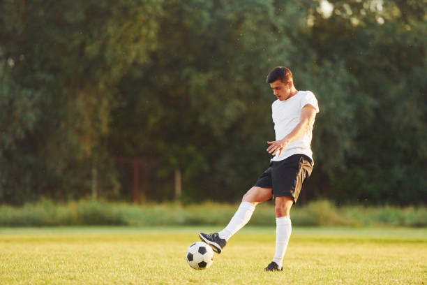 istock Professional practice. Young soccer player have training on the sportive field 1368551577