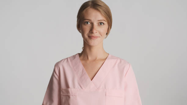istock Beautiful female doctor in uniform posing on camera isolated on 1368554280