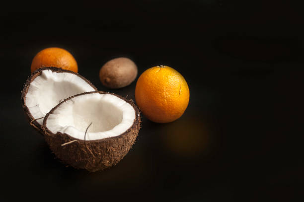 istock summer background from coconut, orange on pink background 1368557476