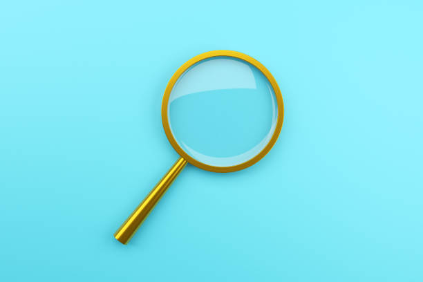 Magnifying glass on blackboard
