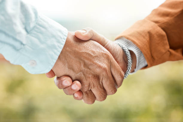 Shot of two unrecognizable men shaking hands outside A gentleman's agreement casual handshake stock pictures, royalty-free photos & images