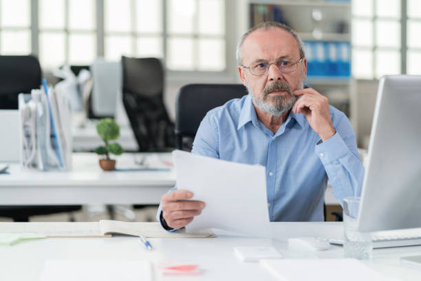 istock A senior businessman working in his modern office 1368559195