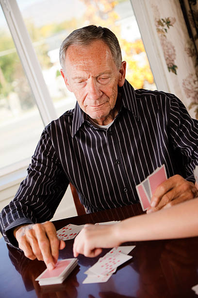 istock Senior Citizen Man Playing Cards 136855944