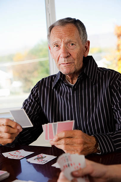 istock Senior Citizen Man Playing Cards 136855959